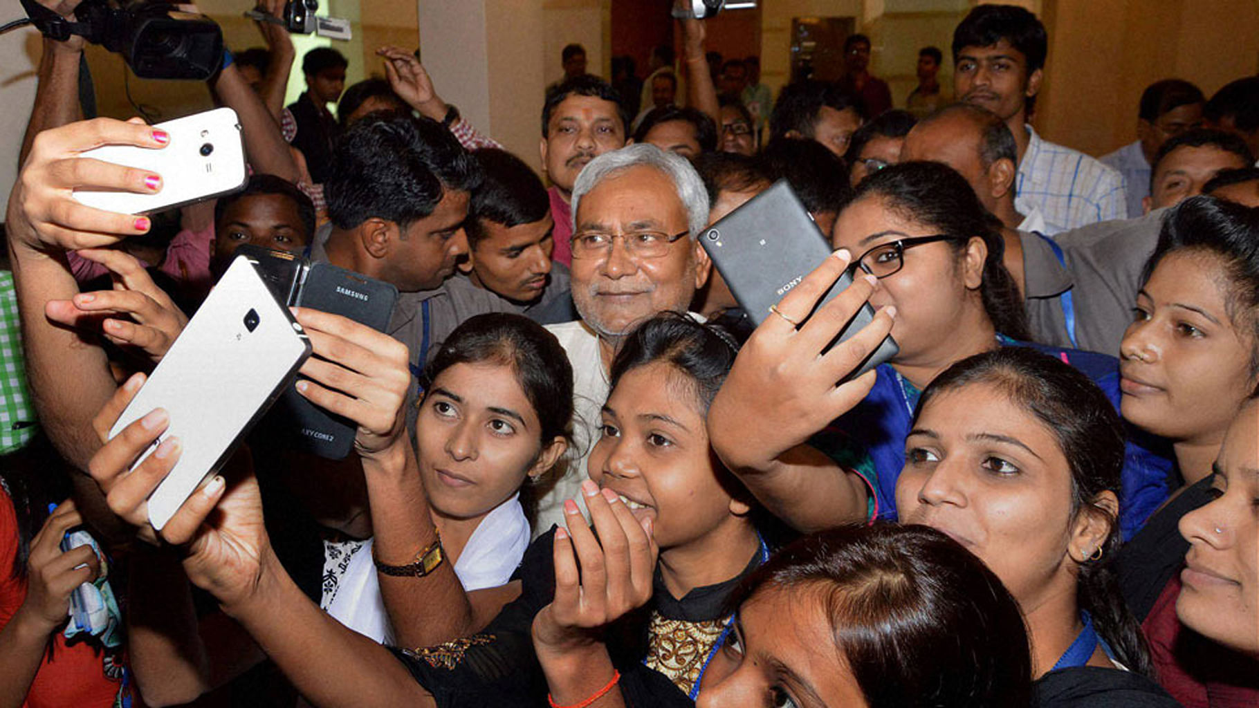 Women click selfies with Bihar chief minister Nitish Kumar in Patna (Photo: PTI)