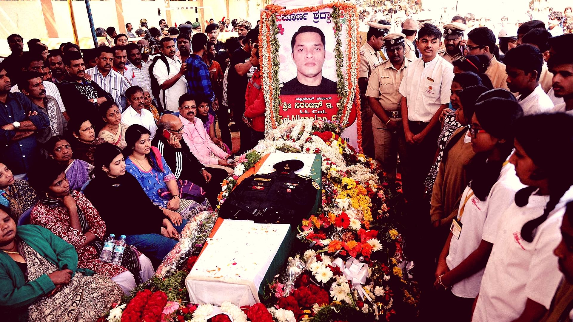 The mortal remains of NSG Lt Col Niranjan, who lost his life in the Pathankot attack, were brought to his Bengaluru residence. (Photo: PTI)