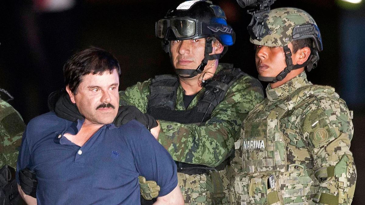 Mexican drug lord El Chapo paraded in front of the cameras by the police. (Photo: AP)