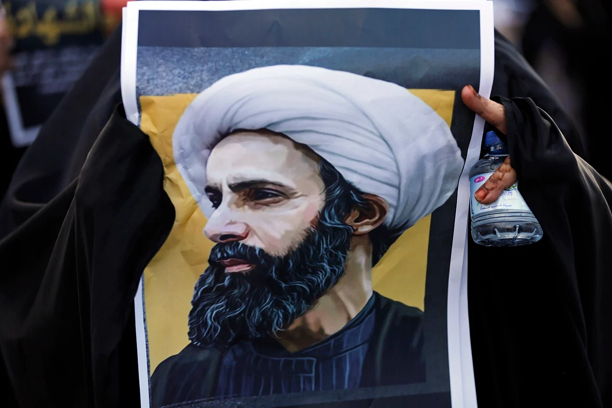 A Bahraini protester holds a picture of Saudi Shiite cleric Sheikh Nimr al-Nimr during a rally denouncing his execution in Daih, Bahrain. (Photo: AP)