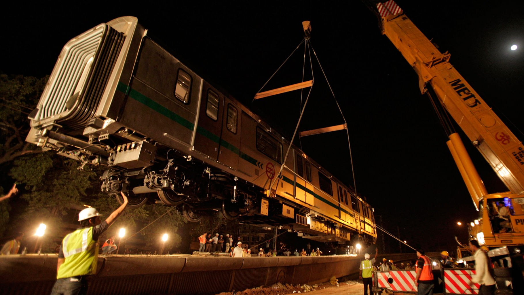 A file photo of a metro rail carriage been lifted on to a track for trial runs. (Photo: Reuters)