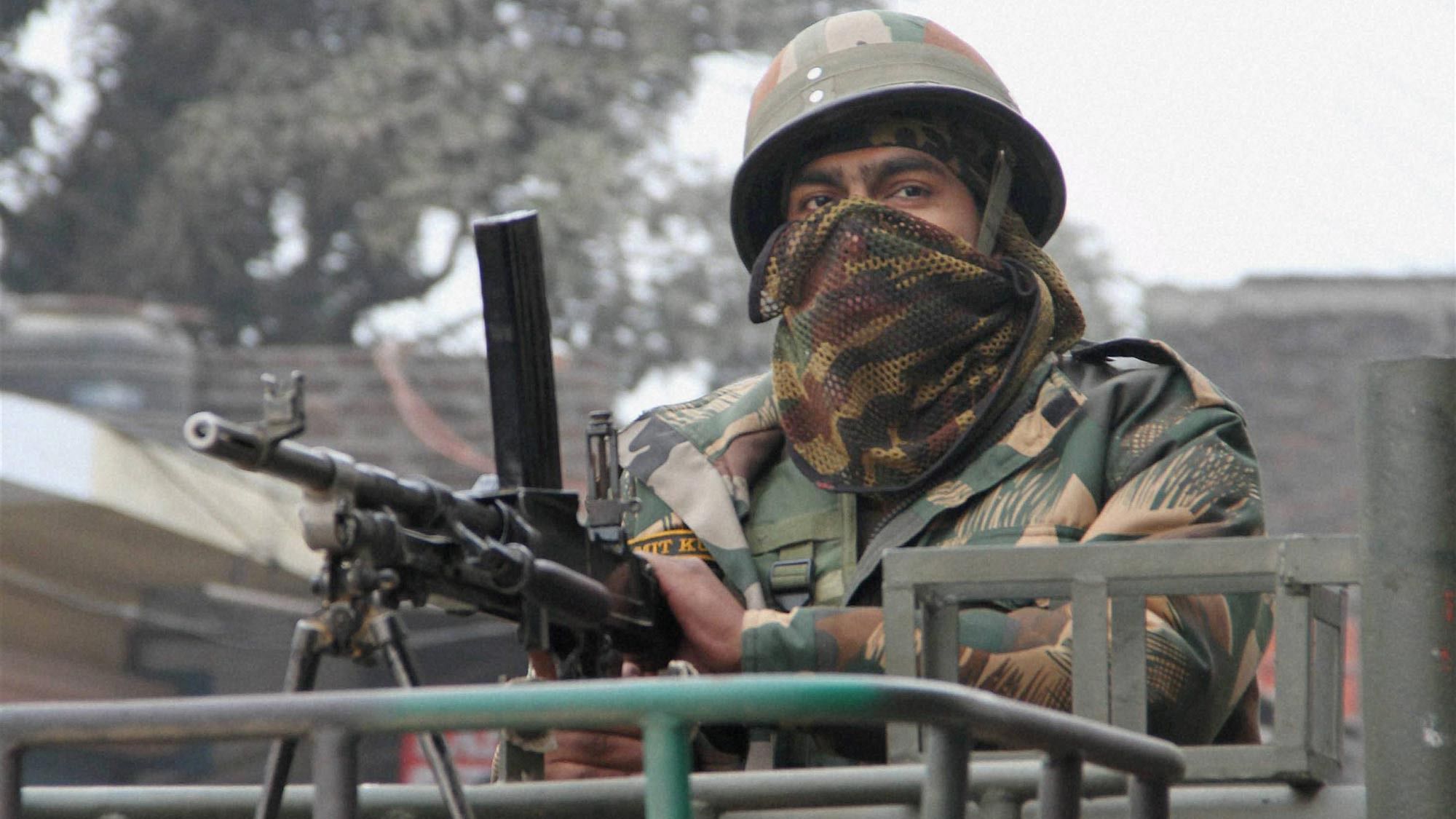 An army person guards during the operation against the militants at the Indian Air Force base in Pathankot on Monday. (Photo: PTI)