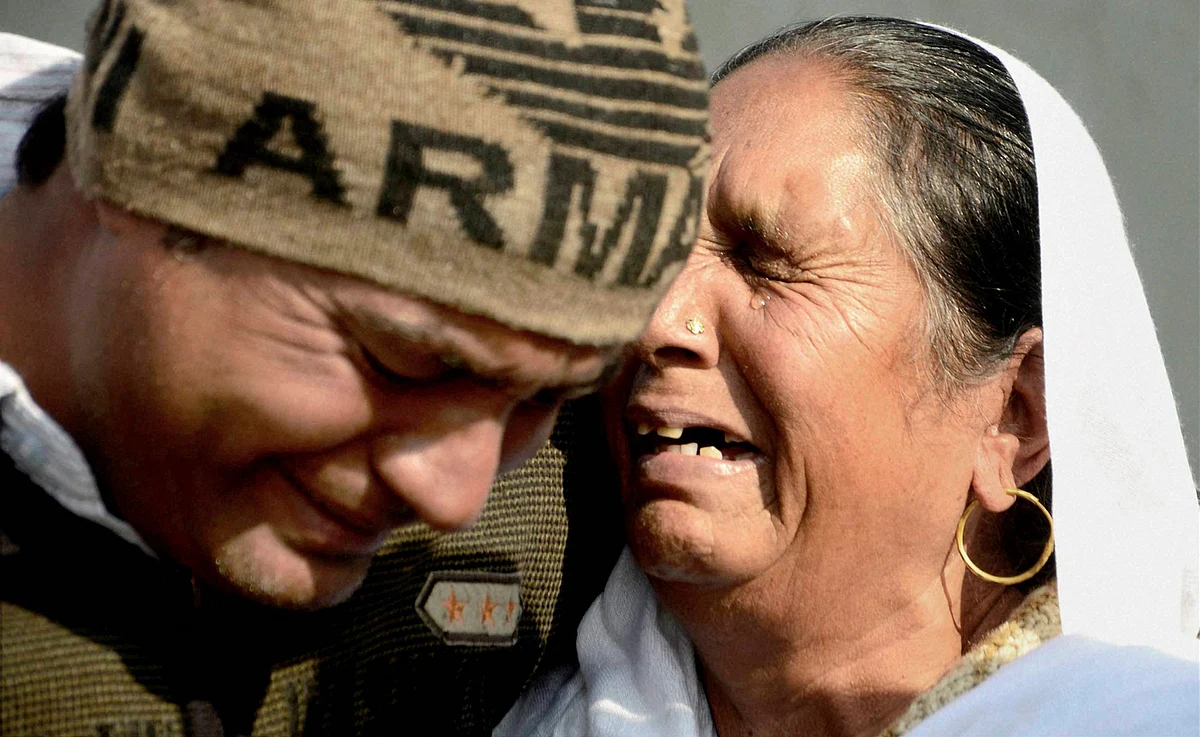 Family members of martyr Defence Security Corps (DSC) Hawaldar Kulwant Singh mourning at his house at Chak sharif village near Gurdaspur. (Photo: PTI)