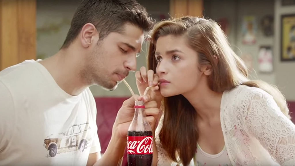 Sidharth Malhotra and Alia Bhatt in the new Coca-Cola advertisement. (Photo Courtesy: <a href="https://www.youtube.com/watch?v=kHqzelxZMEs">YouTube/lostinthewoods</a> Screengrab)