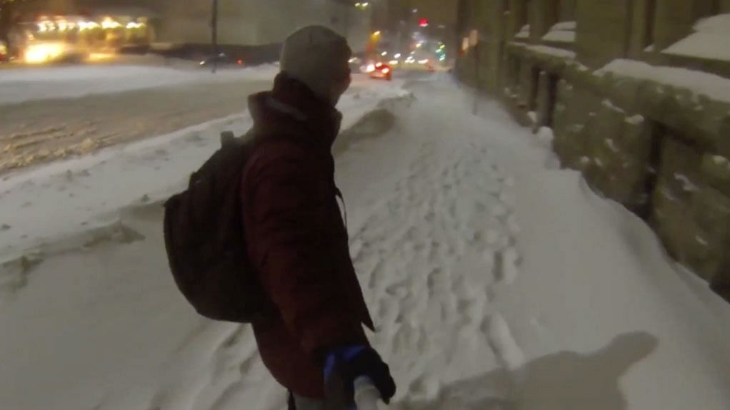 Bored of his usual commute, this man decided to take advantage of the snow and snowboard home instead. (Photo: AP screengrab)