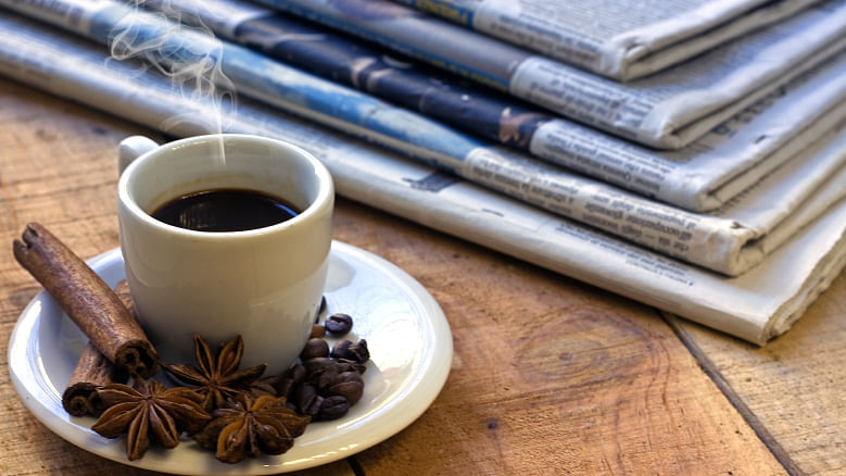 Nothing like a cup of coffee and your Sunday morning reads. (Photo: iStock)