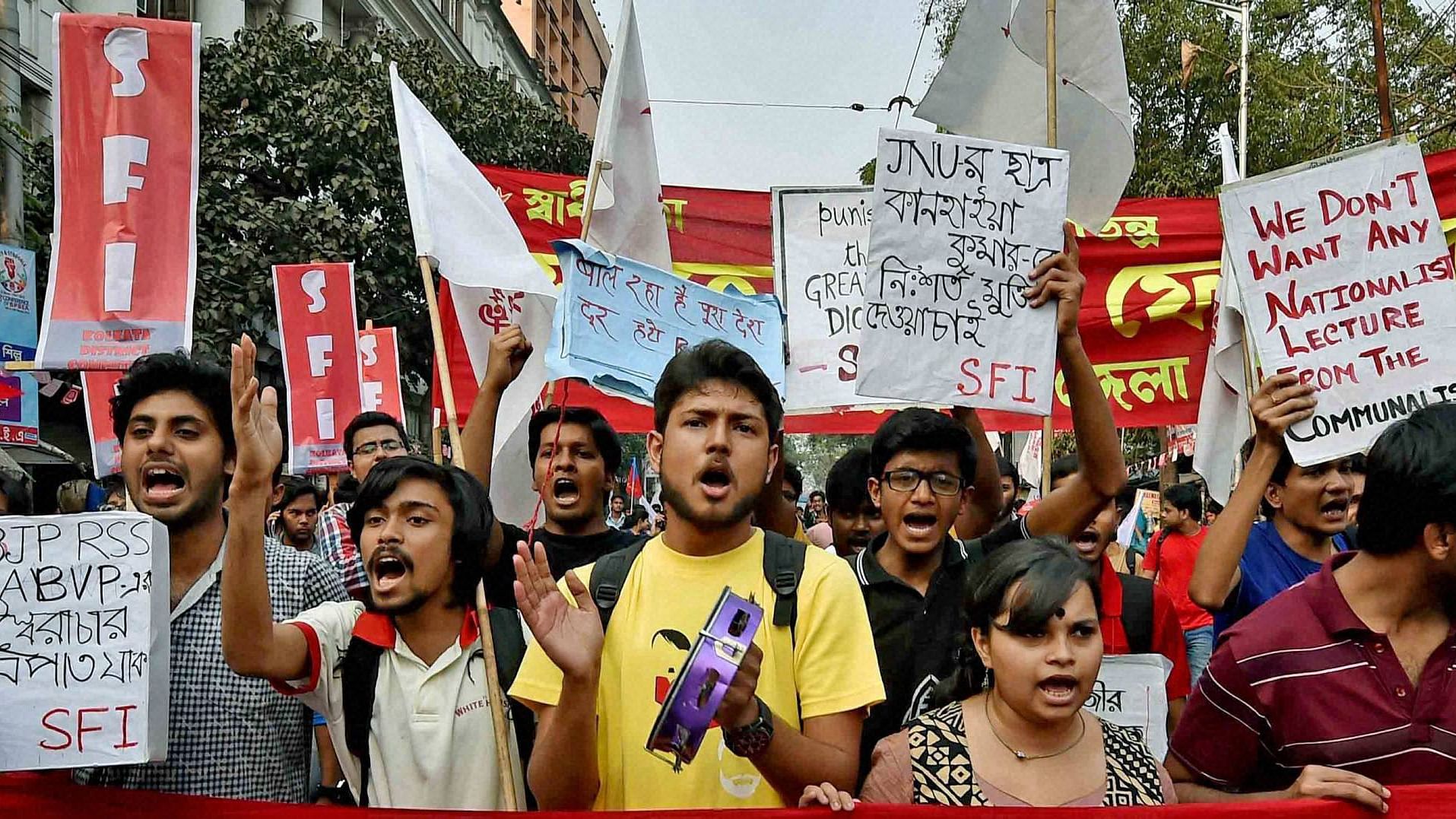 Activists of Left parties’ students wings take out a protest rally condemning the arrest of JNUSU Leader Kanhaiya Kumar in Kolkata on Wednesday. (Photo: PTI)&nbsp;