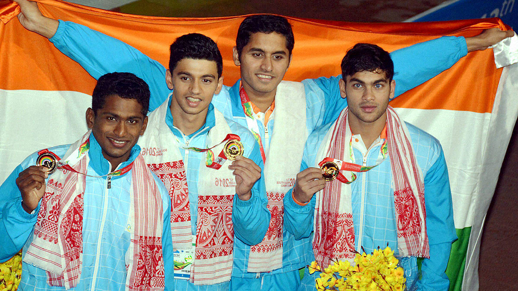 Gold medal winning Indian team after men’s 4x200m freestyle swimming event at the 12th South Asian Games 2016 in Guwahati on Tuesday. (Photo: PTI)