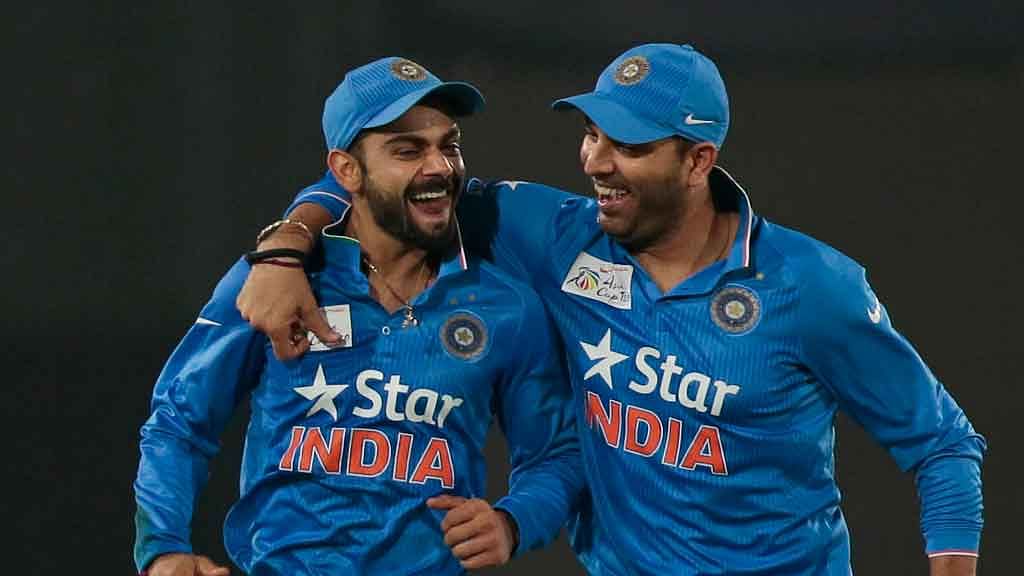 Virat Kohli (L) and Yuvraj Singh (R) steered India to victory with a partnership of 68 runs. (Photo: AP)