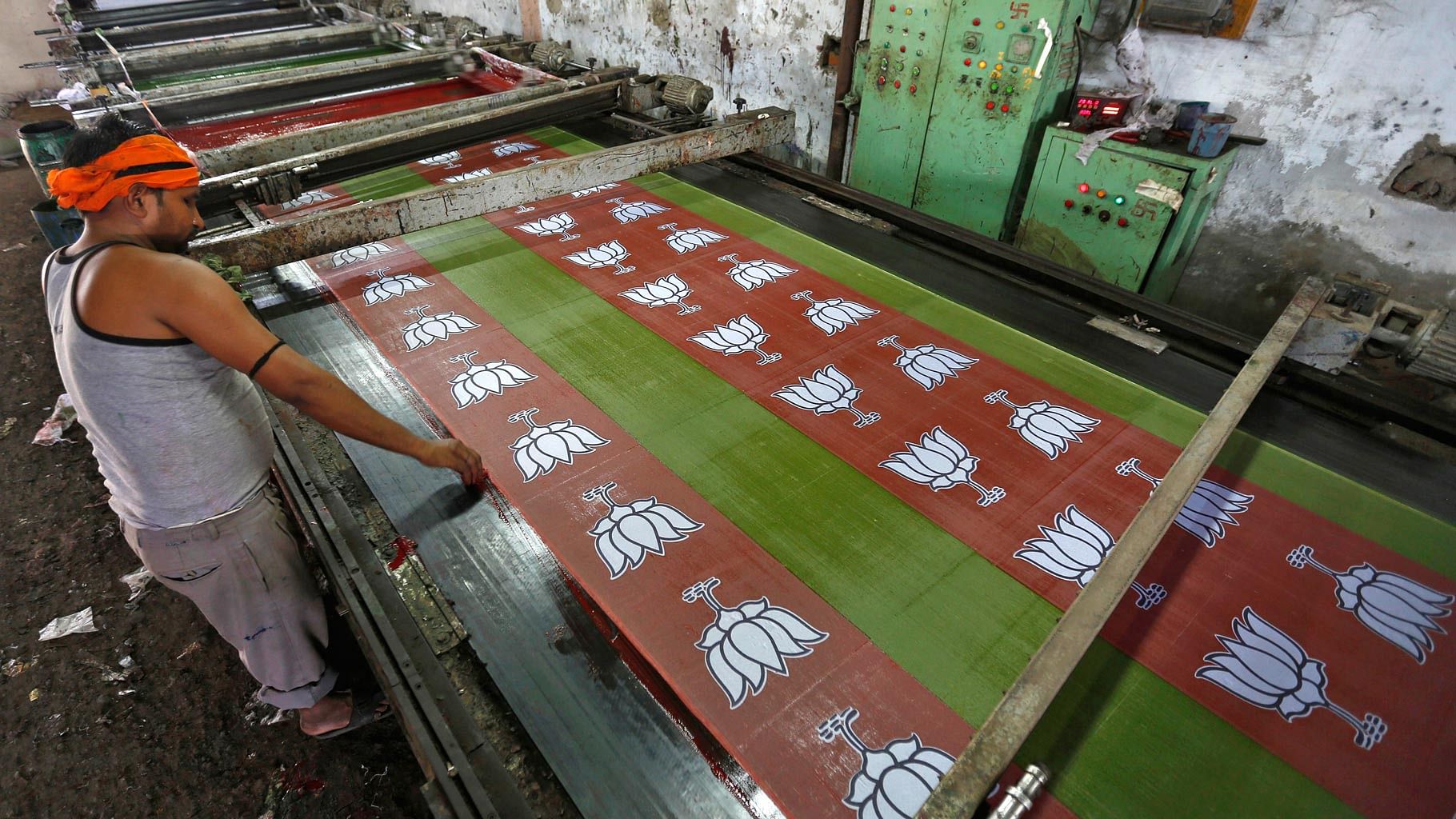BJP logo being printed on cloth at a factory. (Photo: Reuters)