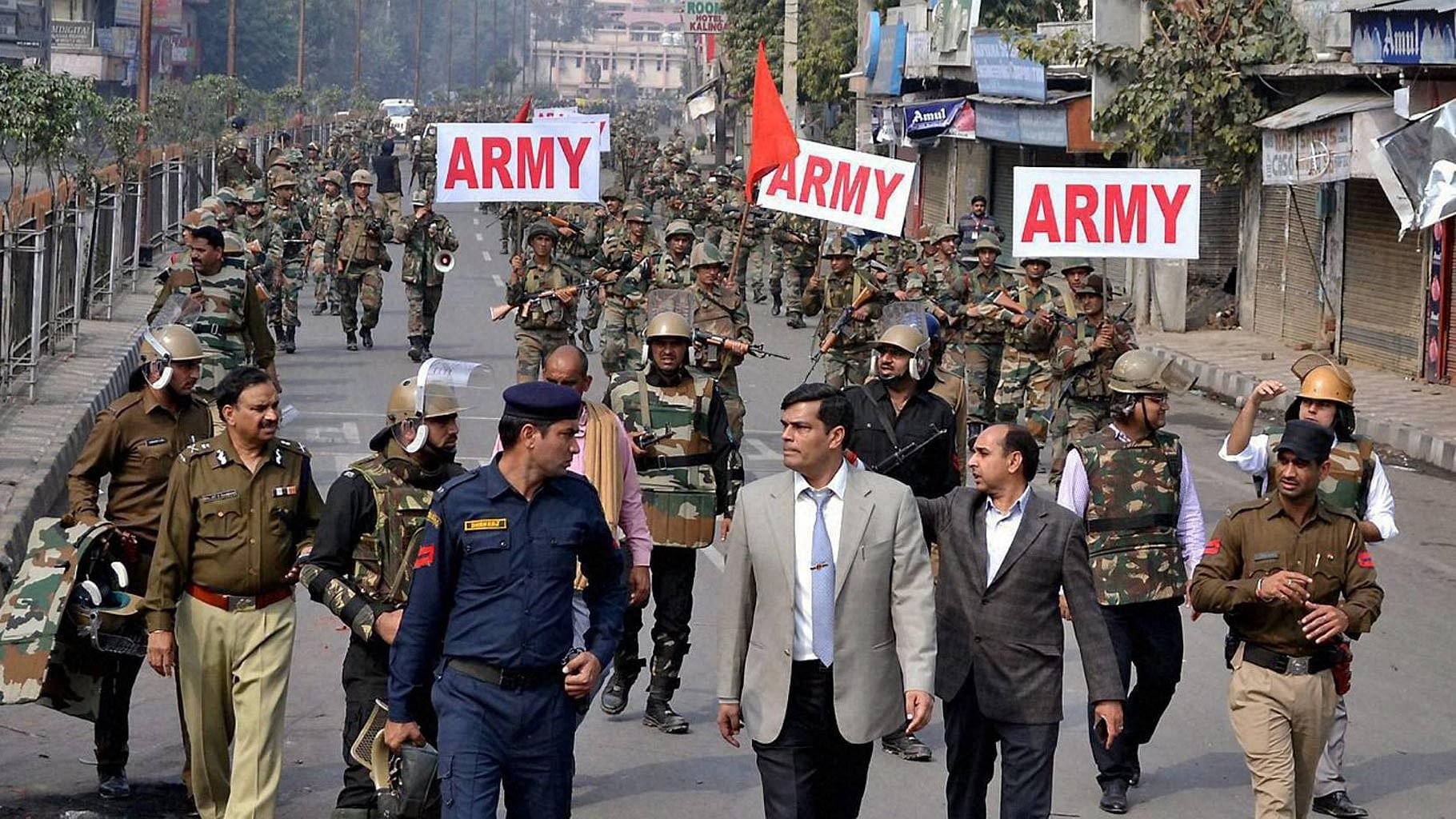 Army during a flagmarch in Rohtak city which is under curfew after protests by Jat community, who are demanding reservation in government jobs and education. (Photo: PTI)