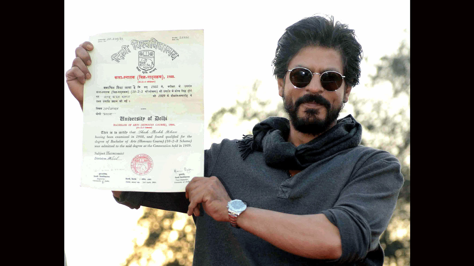 Shah Rukh Khan holds up his graduation certificate (Photo: Yogen Shah)