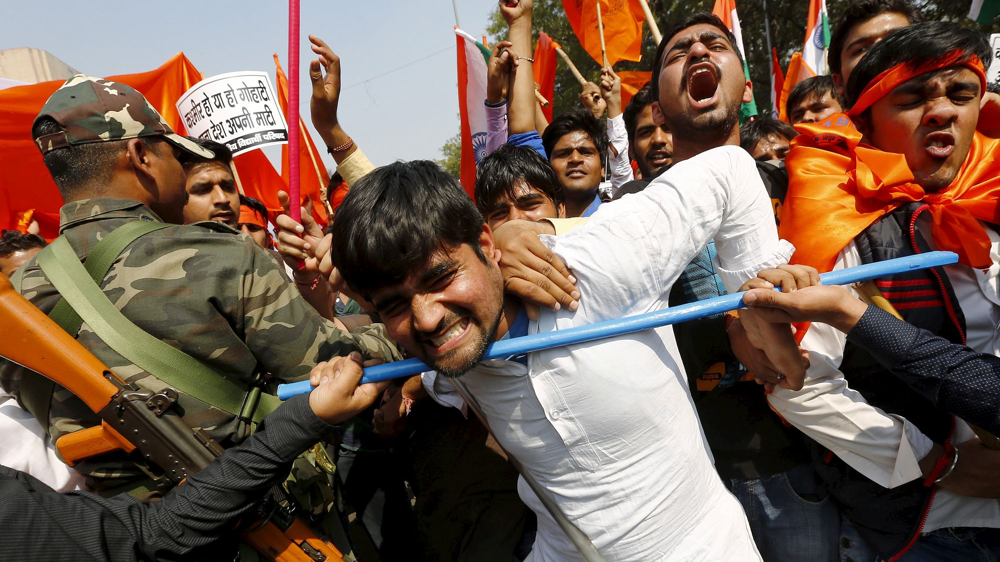 ABVP members, the student wing of BJP, scuffle with security personnel during a protest march in New Delhi on February 24, 2016. (Photo: Reuters/Adnan Abidi)