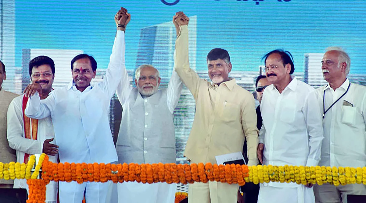 Prime Minister Narendra Modi raises hands
with Chief Minister of Andhra Pradesh, N. Chandrababu Naidu and the Chief
Minister of Telangana, K. Chandrashekar Rao at a function in Andra Pradesh.
(Photo: PTI)
