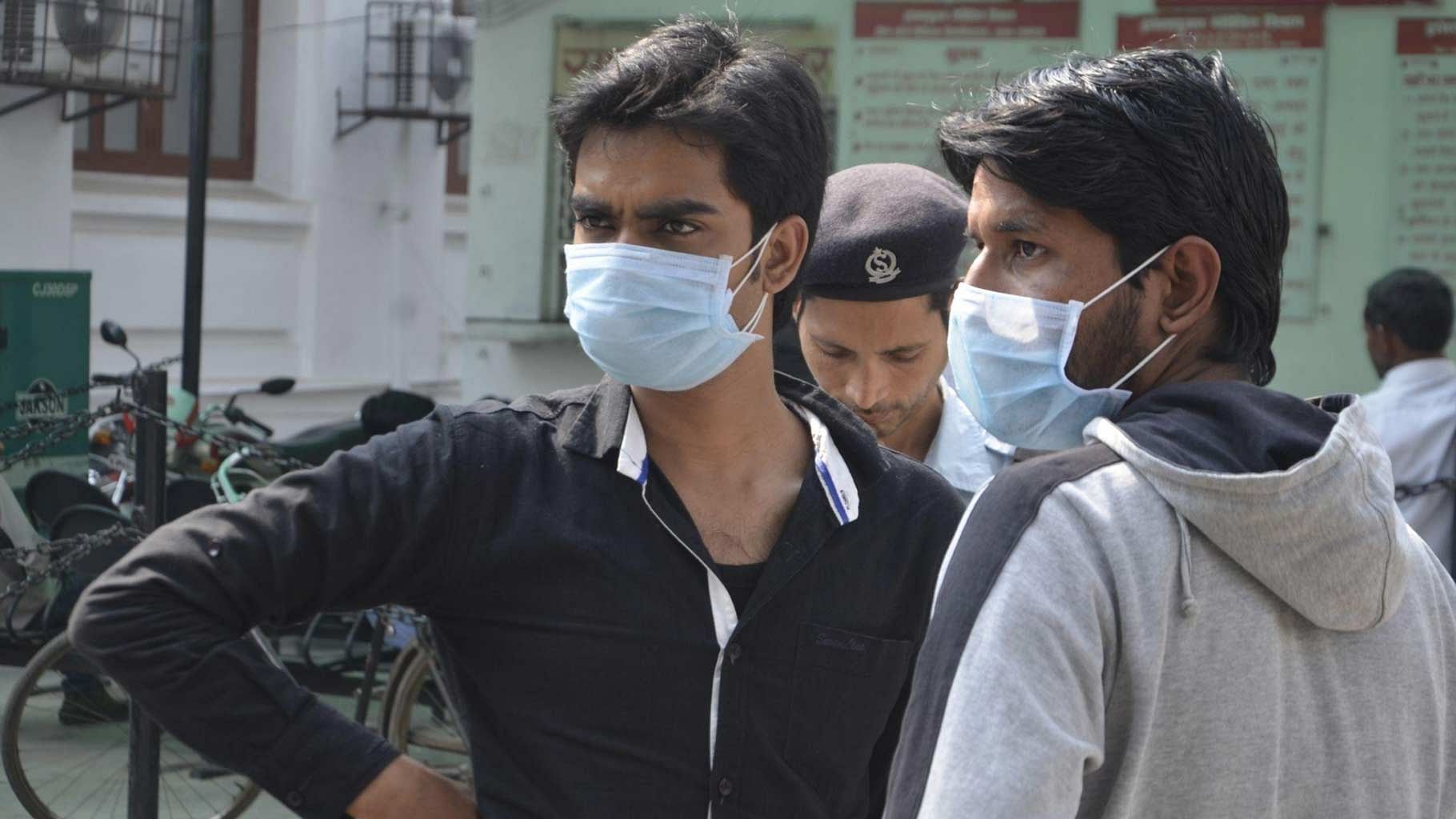 Men wear masks as a preventive measure to swine flu.&nbsp;