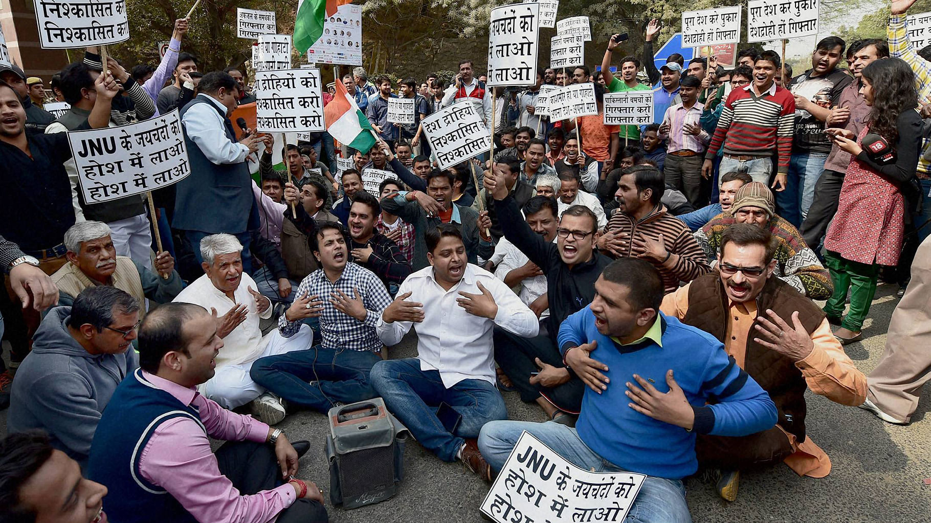  Residents of Munirka village protest outside JNU against the organising of a meet to “mourn” the hanging of  Afzal Guru. (Photo: PTI)