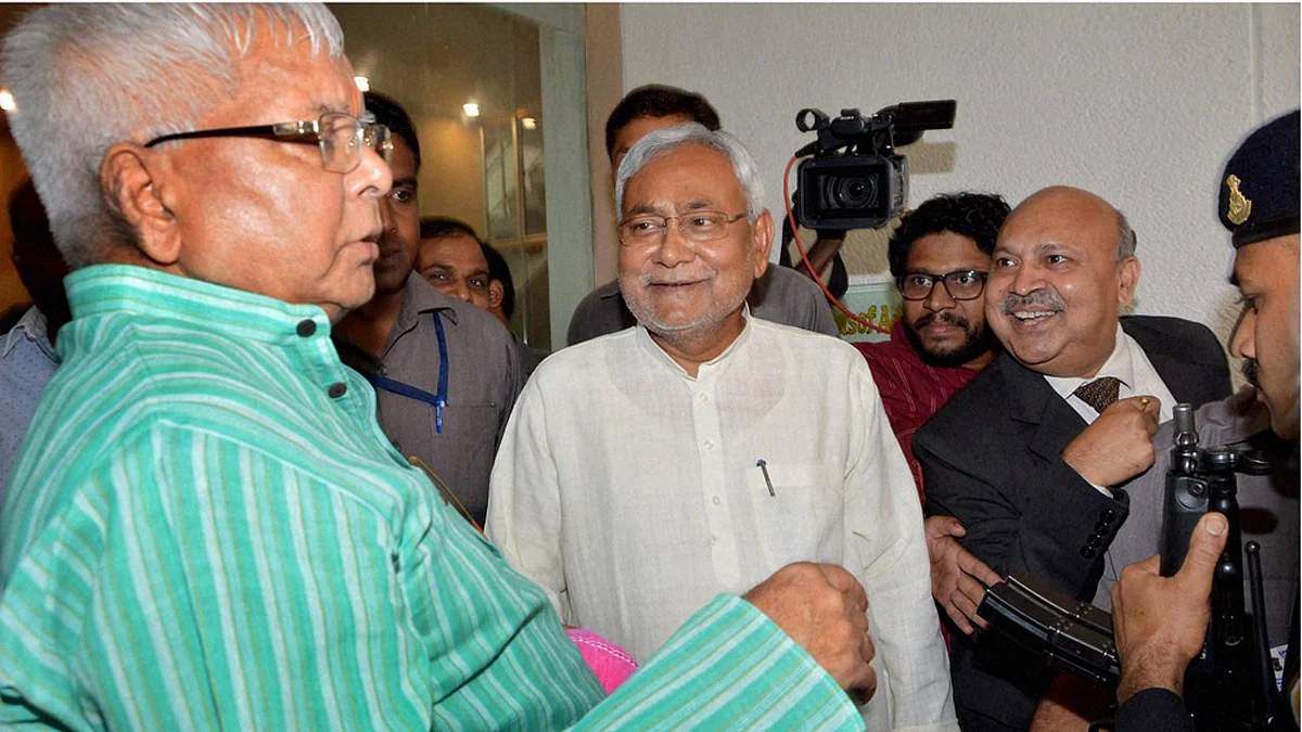 Bihar Chief Minister Nitish Kumar with RJD chief Lalu Prasad during a programme on Bihar elections in Patna. (Photo: PTI) 