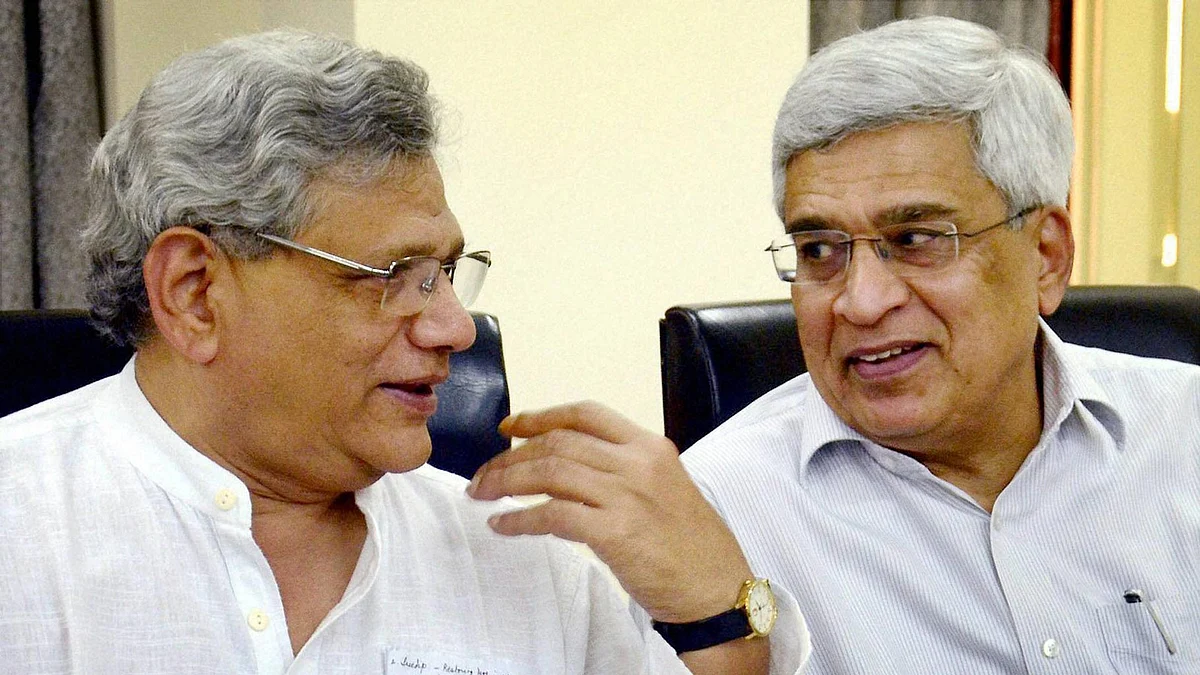 Sitaram Yechury, CPI(M) General Secretary with Prakash Karat (right) during the party meeting on upcoming Bengal polls. (Photo: PTI)