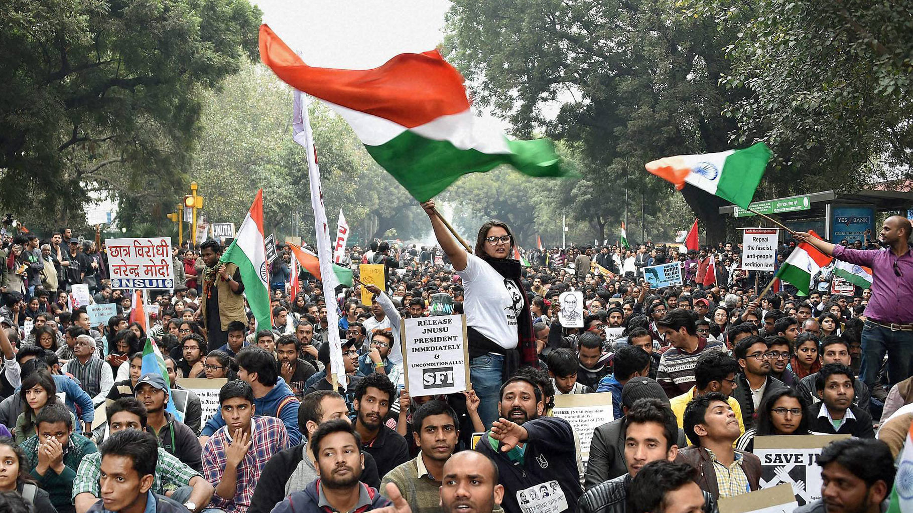 Students of various organisations wave tricolours at Parliament Street during their march from Mandi House to Jantar Mantar demanding the release of JNUSU Kanhaiya Kumar and the dropping of sedition charges against him, in New Delhi on Thursday. (Photo: PTI)