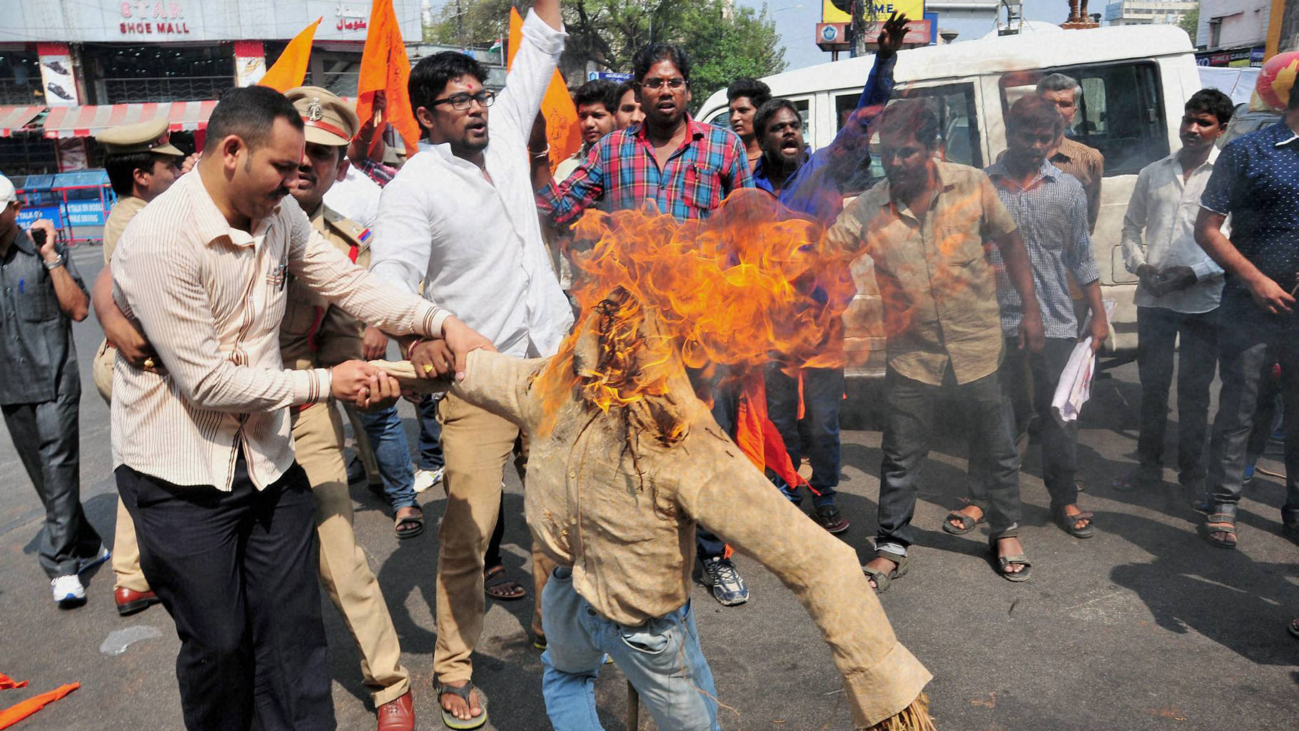 Bajrang Dal activists burning effigy and protesting celebration of Valentines day in Hyderabad on Sunday. (Photo: PTI)