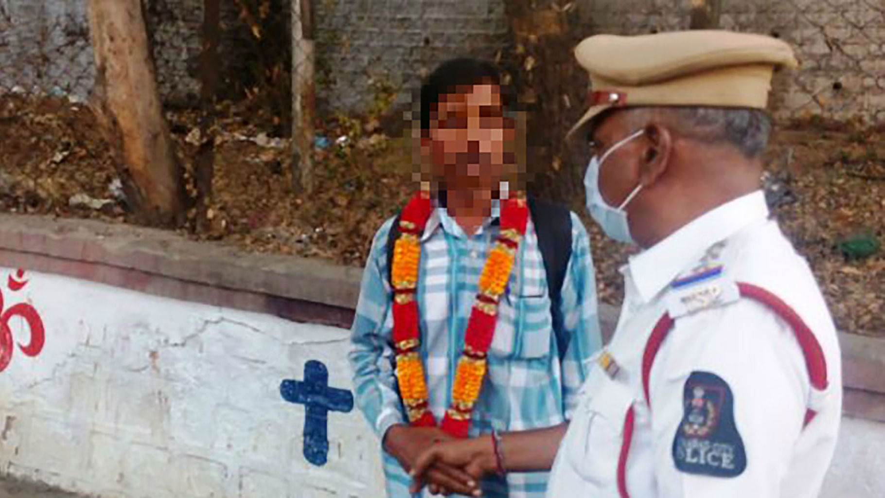 This man was garlanded after he was caught urinating. (Photo: The News Minute)