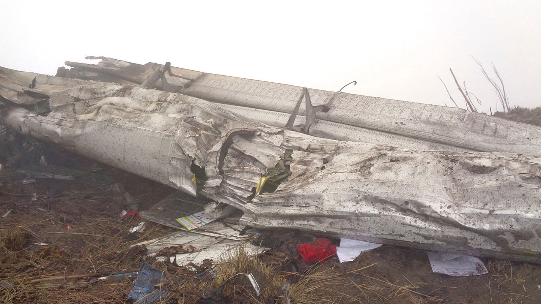 Part of the wreckage of a
plane lies near Rupshe village in Katmandu, 24 February 2016. (Photo: AP)