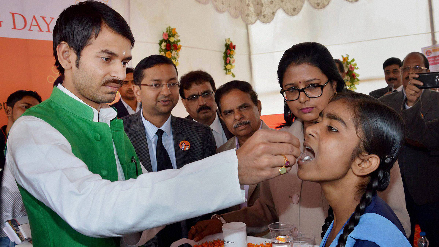 Bihar Health Minister Tej Pratap administers a chewable albendazole 400 mg chewable tablet to school girls during inauguration of National Deworming Day in Patna on 10 February. (Photo: PTI)