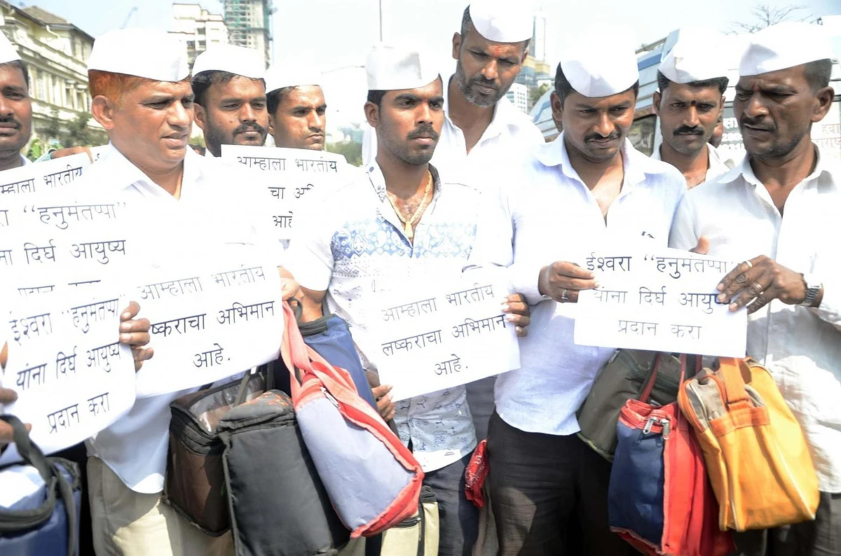 The famed Mumbai dabbawallahs pray for Hanumanthappa’s recovery. (Photo: IANS)