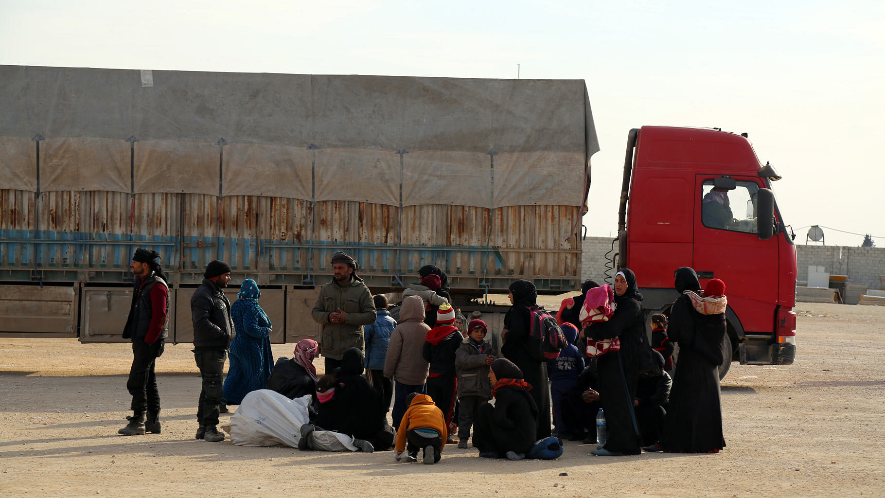 Syrians fleeing the conflict in Azaz region, wait at the Bab al-Salam border gate in Syria. (Photo: AP)