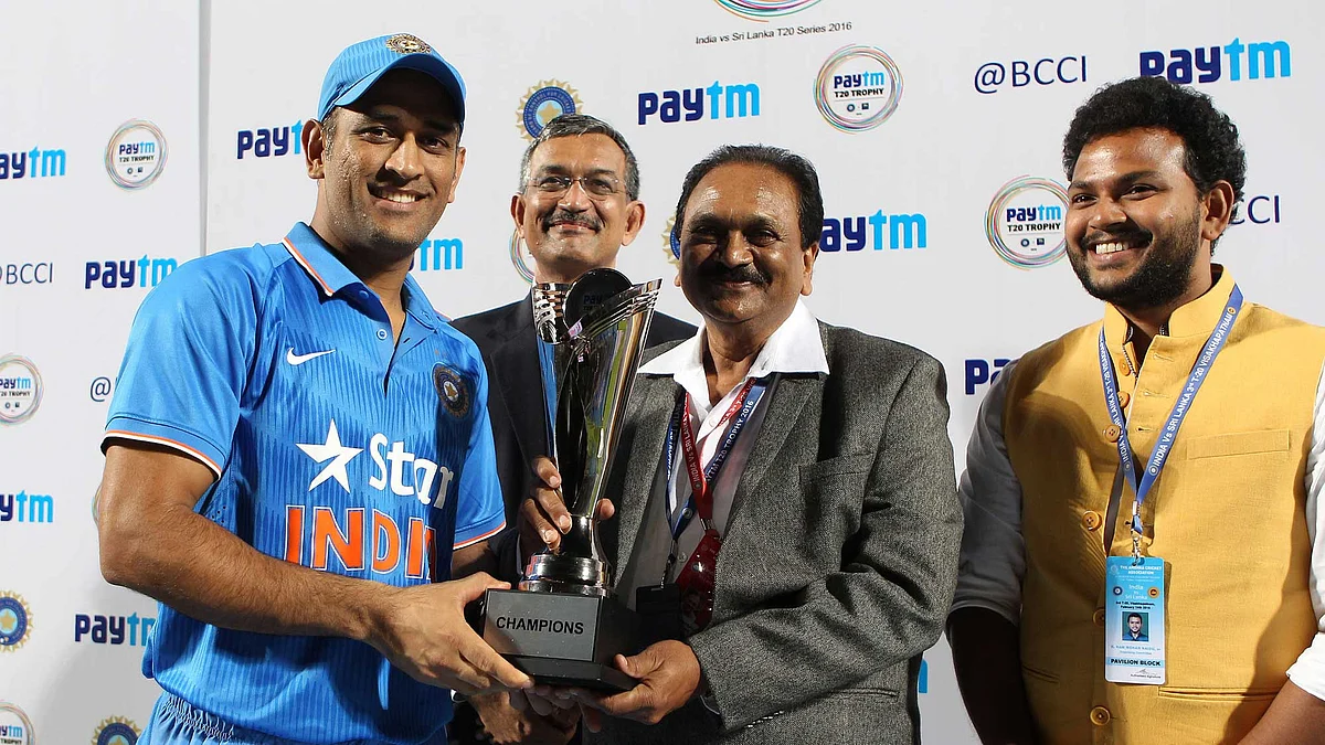 MS Dhoni with the series trophy following the win over Sri Lanka. (Photo by: Ron Gaunt / BCCI / Sportzpics)