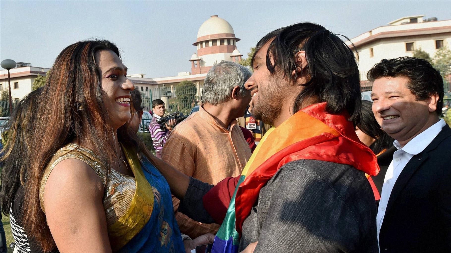 Gay rights supporters celebrate outside the Supreme Court in New Delhi on Tuesday.