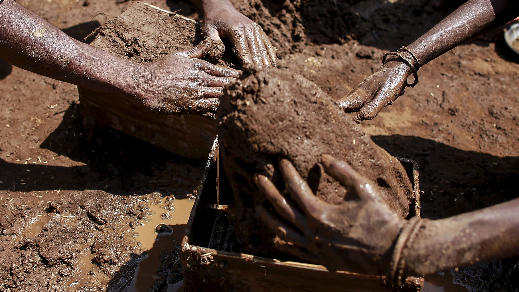 Bonded labourers preparing to make bricks in a Kota kiln. (Photo: Reuters)