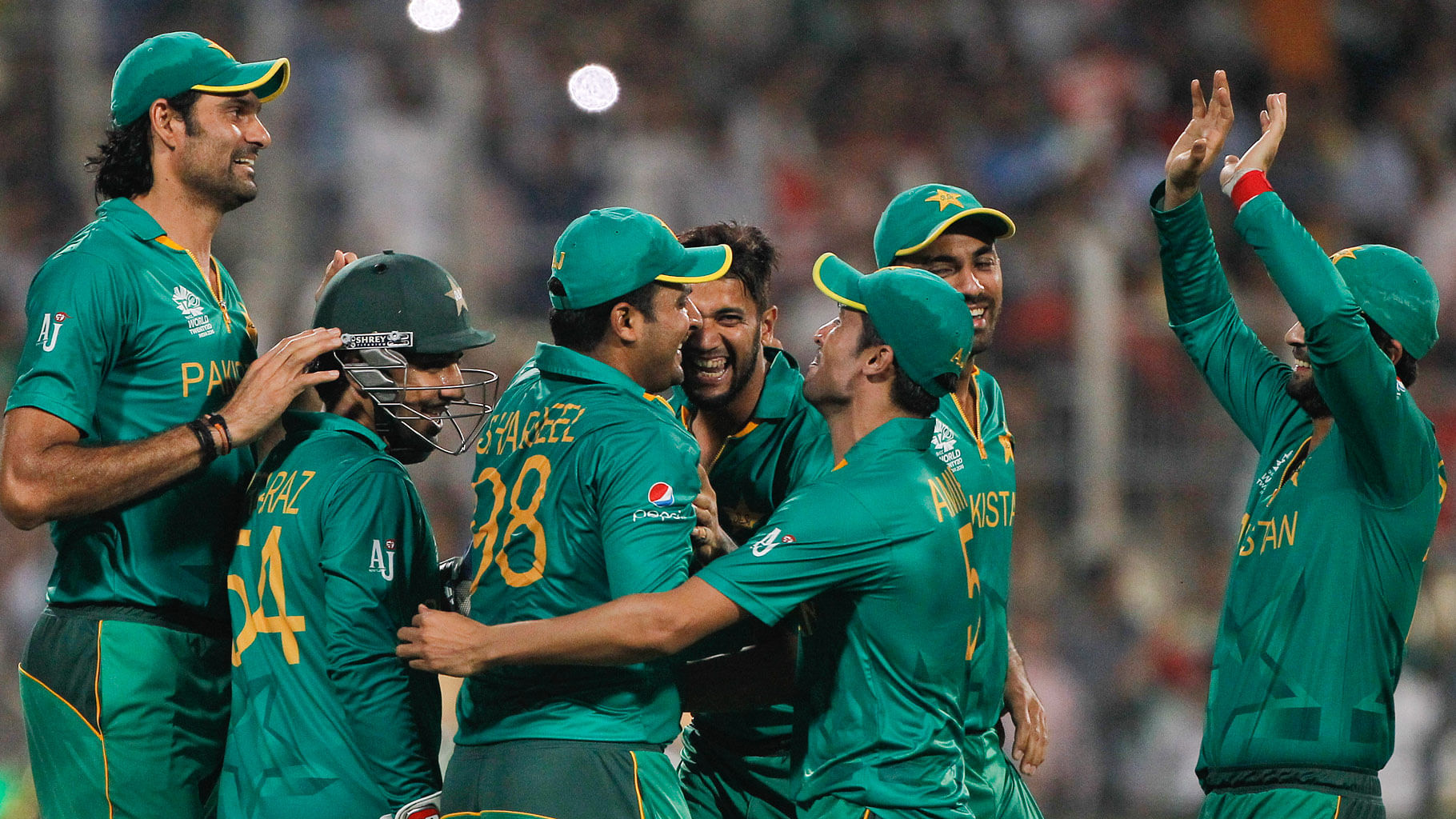  Pakistan players  celebrate after Sharjeel Khan took a catch to dismiss Bangladesh’s Mashrafe Mortaza. (Photo: AP)