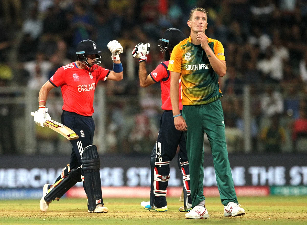 England’s Joe Root celibrates with Moeen Ali after hitting a four as South Africa’s Chris Morris watches during their ICC World Twenty20 2016 cricket match at the Wankhede stadium (Photo: AP)