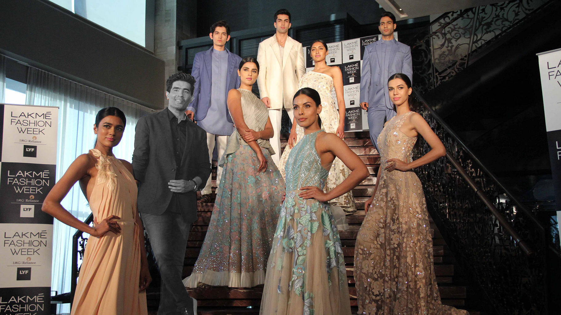Manish Malhotra poses with the models wearing his preview collection for Lakmé Fashion Week 2016 (Photo: Yogen Shah)