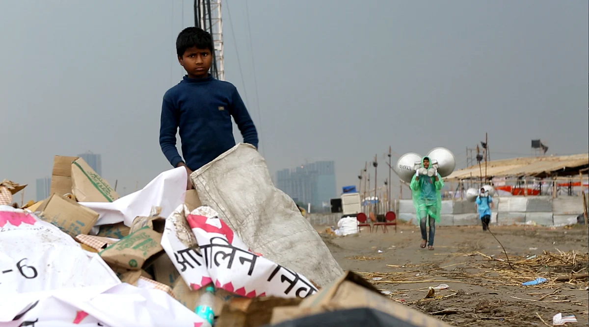Rag-pickers go through the trash left by tens of thousands of Art of Living devotees. (Photo: Sanjoy Deb)