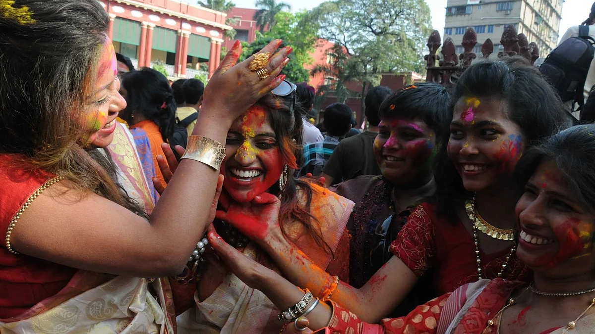 Students of Rabindra Bharati University play with colours during holi at Jorasanko Thakur Bari campus in Kolkata, on March 15, 2016. (Photo: IANS)