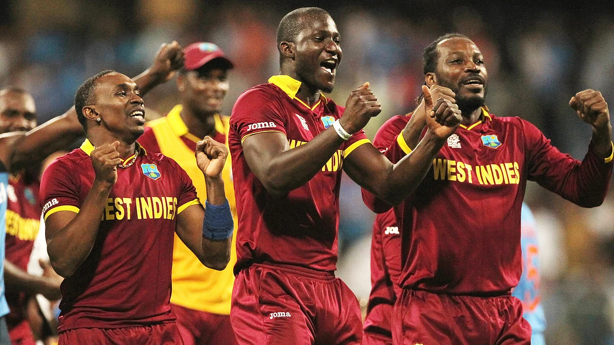 Dwayne Bravo, Darren Sammy and Chris Gayle. (Photo: AP)