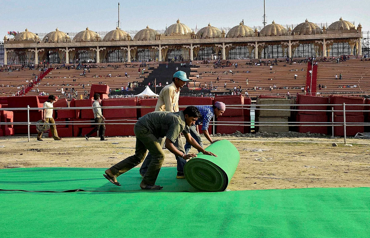 Workers make arrangements for the three-day World Peace Festival organised by spiritual guru Sri Sri Ravi Shankar in New Delhi on Wednesday. (Photo: PTI)