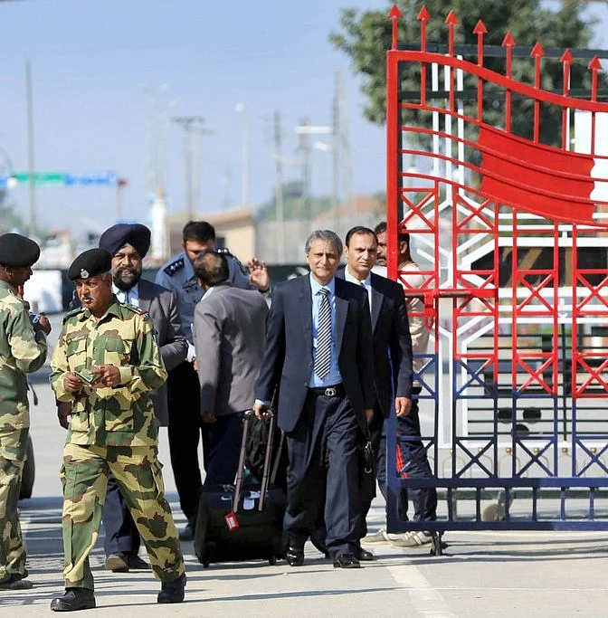 PCB’s security team cross over to India vie the Wagah Border. The two member team was sent to check the security provisions for the India-Pakistan World T20 match. (Photo: IANS) 