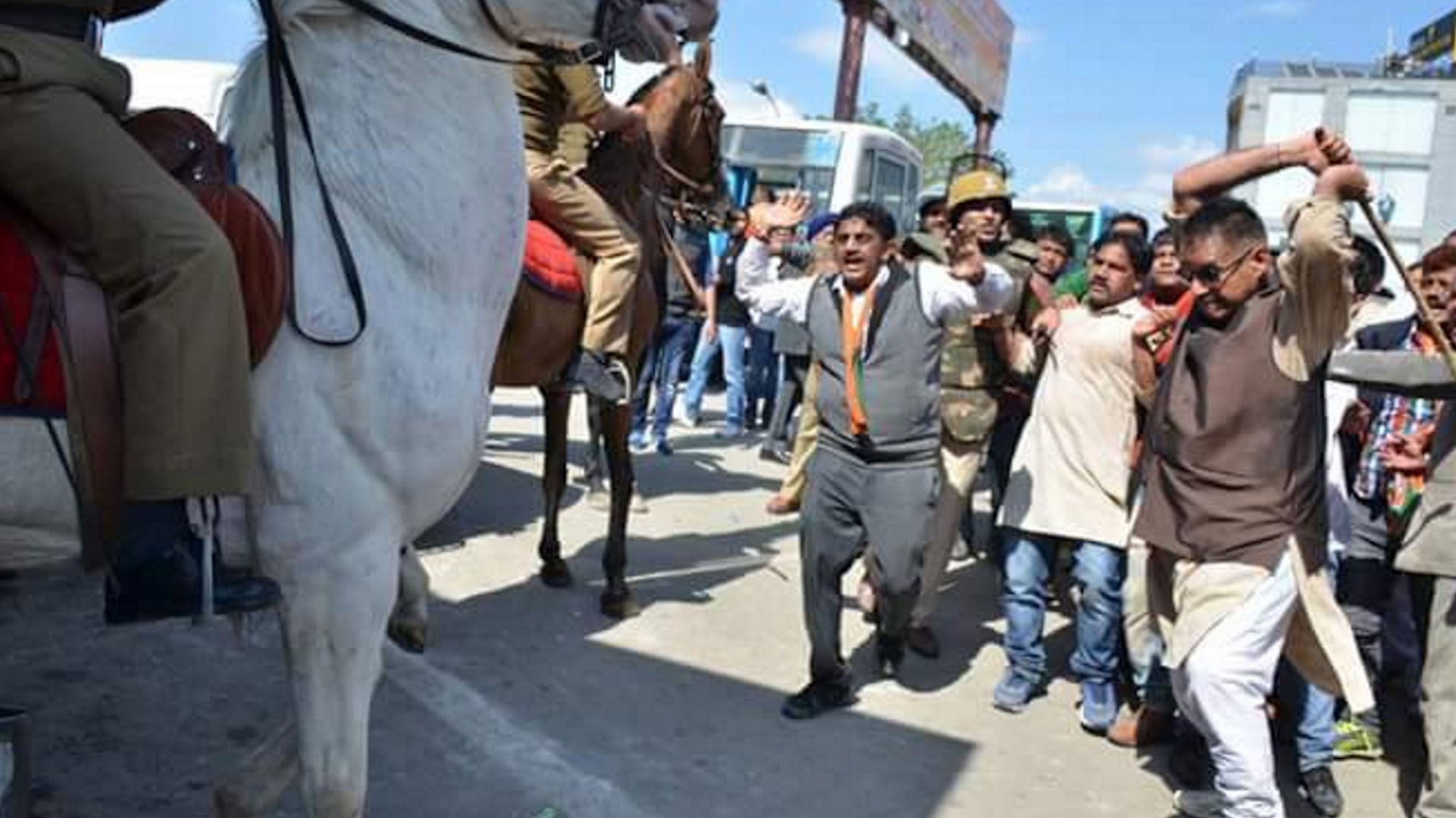 BJP MLA Ganesh Joshi allegedly beating a horse during a protest march in Dehradun. (Photo: ANI screengrab)