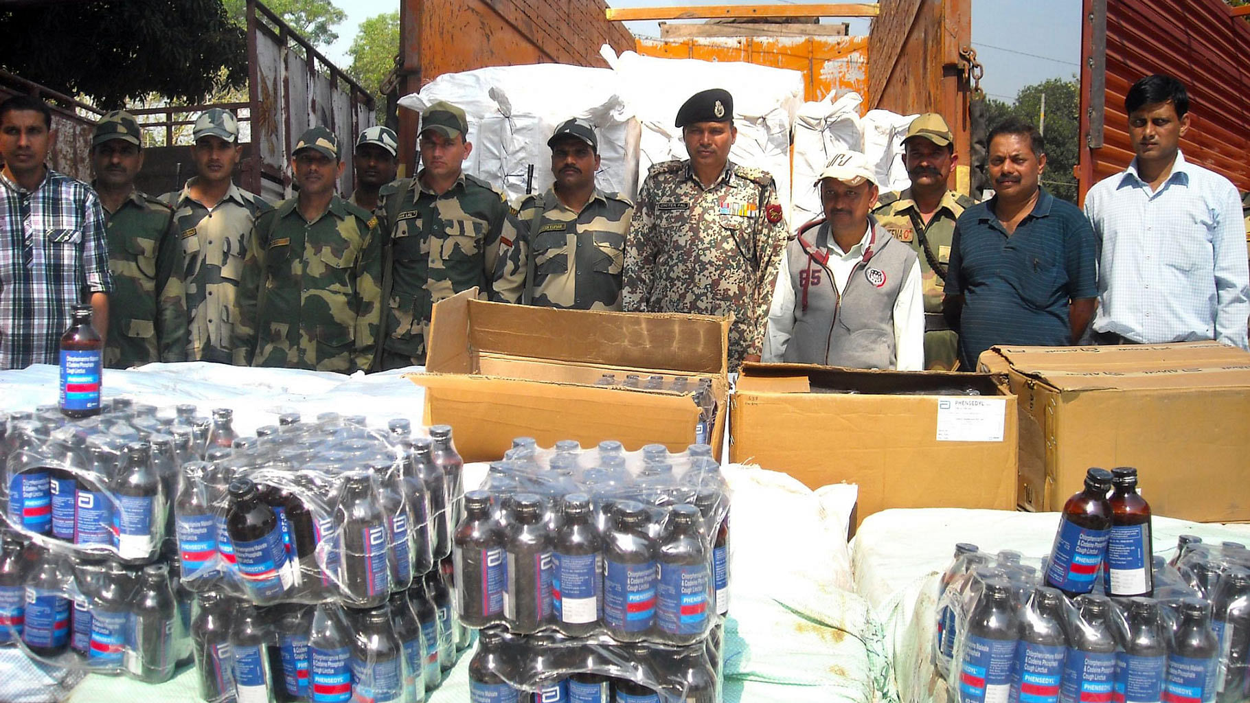 BSF officials present before press cough syrup bottles worth Rs One crore that were seized from Bhagalpur border outpost, near Agartala on 15 March 2015.  (Photo Courtesy: IANS)