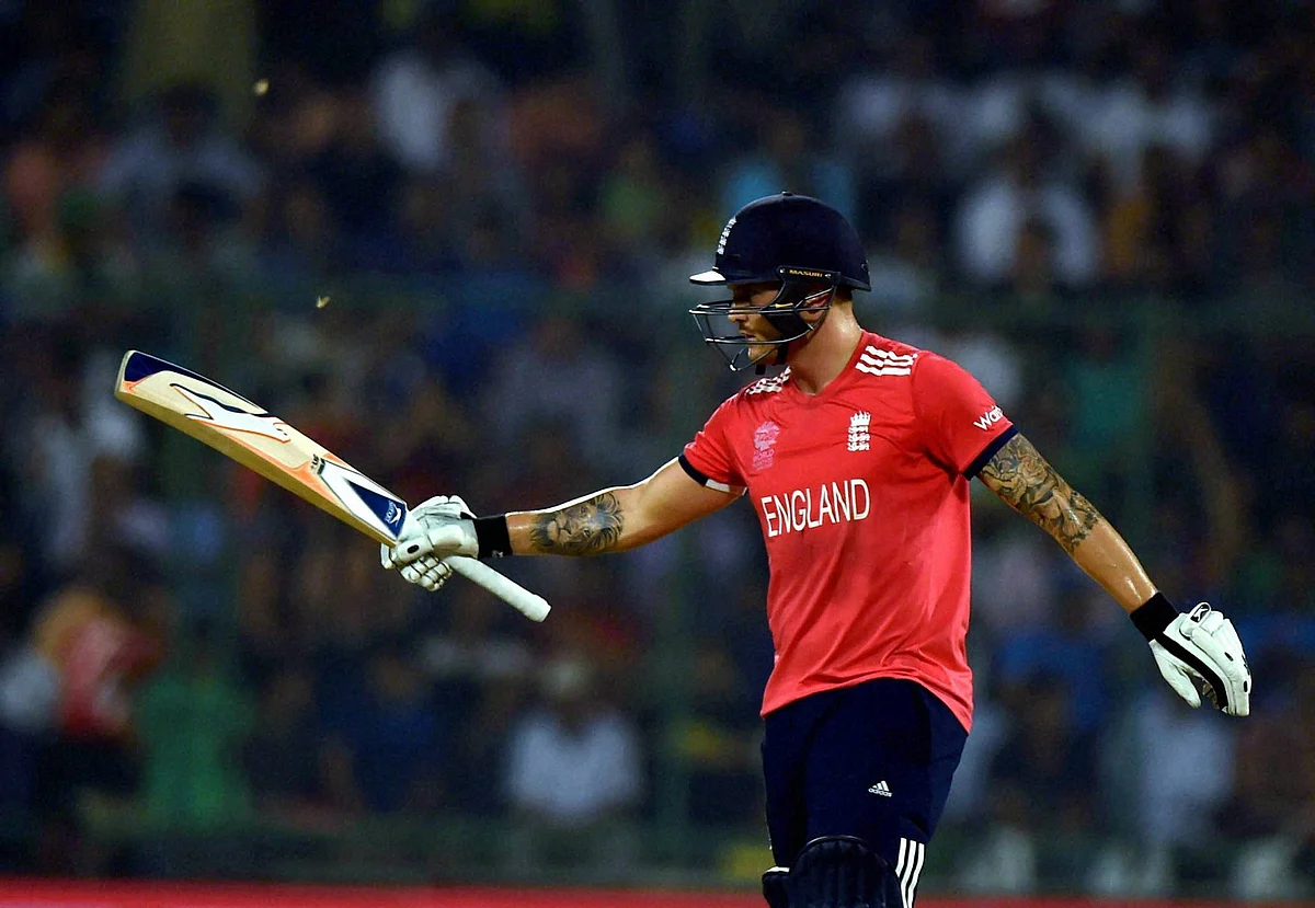 Jason Roy raises his bat after scoring a half-century. (Photo: PTI)