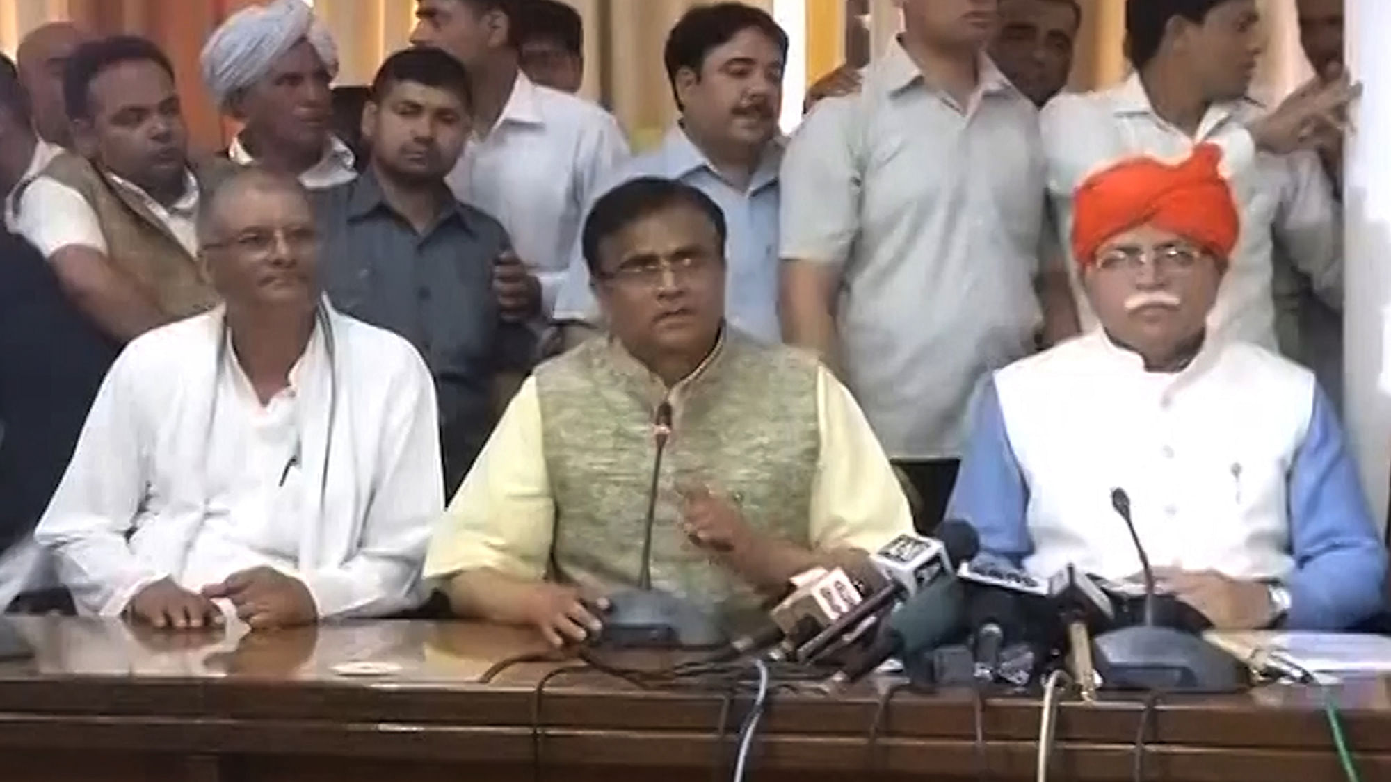 Haryana Chief Minister Manohar Lal Khattar (right) addressing the media after the Jat Reservation Bill was passed in the Haryana Assembly on Tuesday. (Photo: ANI screengrab)