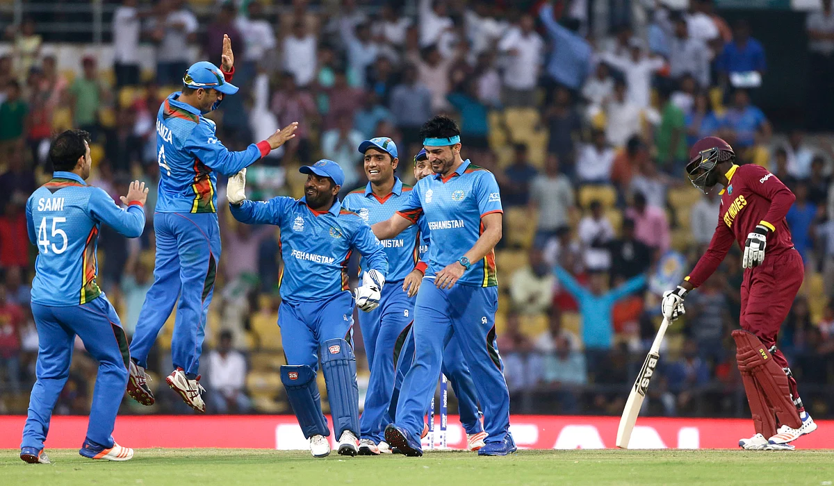 Afghanistan’s players celebrate the run out of West Indies’ Andre Russell (Picture: AP) 
