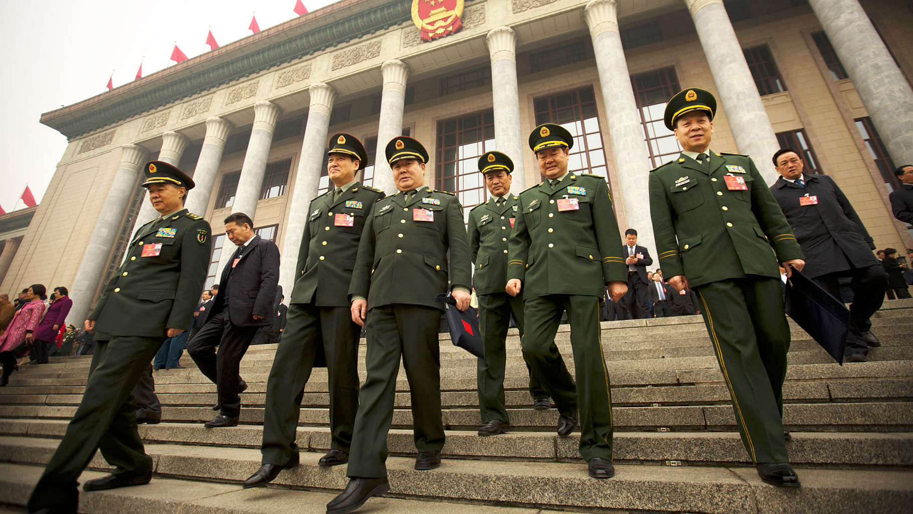 Delegates from the Chinese People’s Liberation Army (PLA) leave the Great Hall of the People in Beijing, Friday, 4 March 2016.