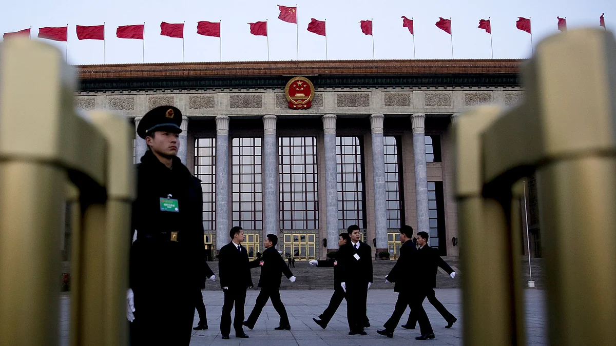 Chinese soldiers dressed as ushers march to their position in front of the Great Hall of the People before the opening session of the annual National People’s Congress in Beijing, 5 March 2016. (Photo: AP)