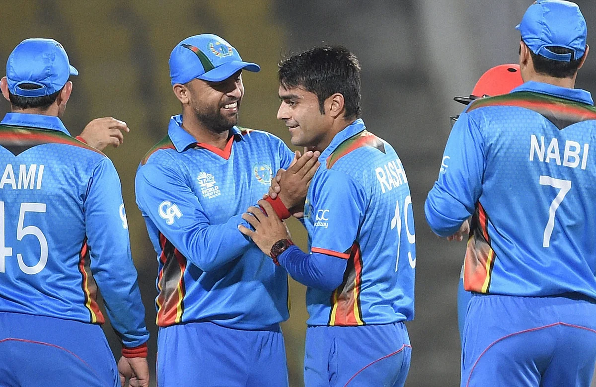 Afghanistan bowler Rashid Khan, center, celebrates a wicket in
a T20 WC match against Hongkong in Nagpur. (Photo: AP)