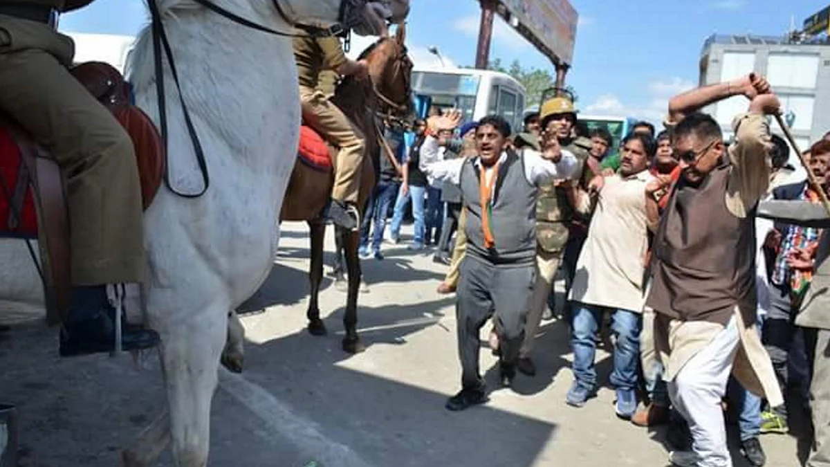 BJP MLA Ganesh Joshi raising a stick on police horse, Shaktiman, during a protest march in Dehradun earlier this week. (Photo: ANI)