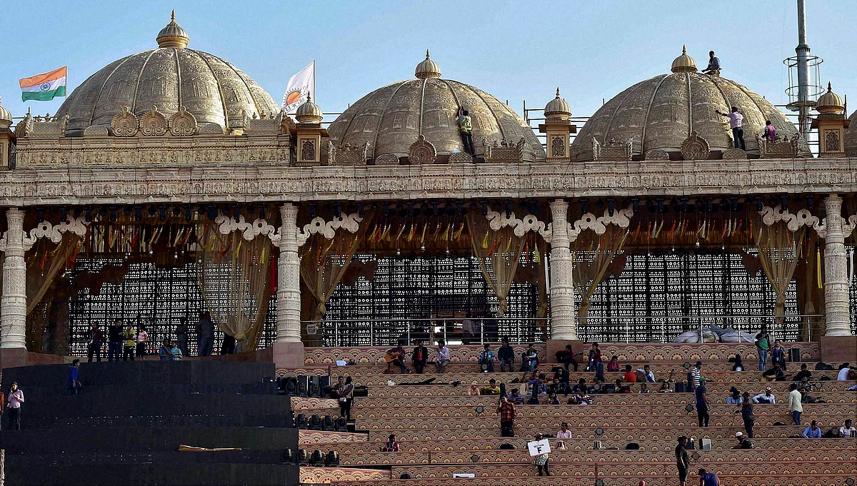 Workers make arrangements for the three-day World Peace Festival organised by spiritual guru Sri Sri Ravi Shankar in New Delhi on Wednesday. (Photo: PTI) 